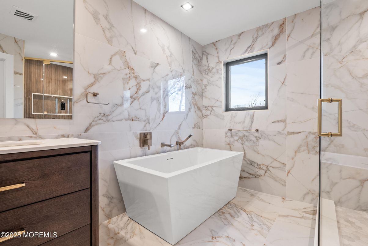 Bathroom, Dual Sink Vanities, Free Standing Baths, Interior, Marble, Marble Walls, Recessed Lighting