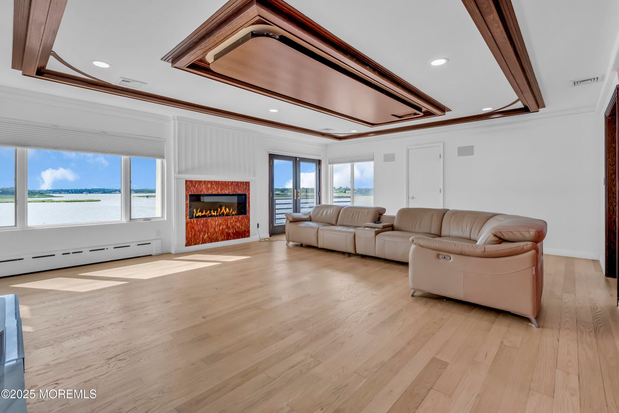 Fireplace, Interior, Living room, Recessed Lighting, Water, Wood Texture Flooring