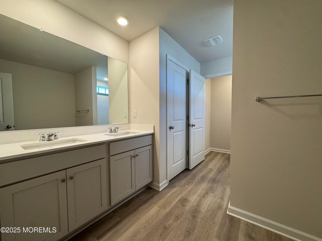 Bathroom, Dual Sink Vanities, Interior, Recessed Lighting, Wood Texture Flooring
