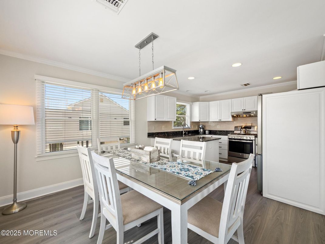 Dining room, Interior, Kitchen, Pendant Lights, Recessed Lighting, Stainless Steel Appliances, Wood Texture Flooring
