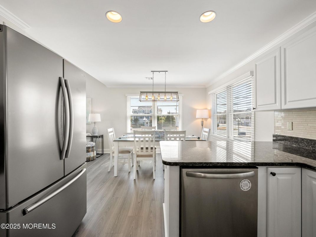 Dining room, Interior, Kitchen, Pendant Lights, Recessed Lighting, Stainless Steel Appliances, Wood Texture Flooring
