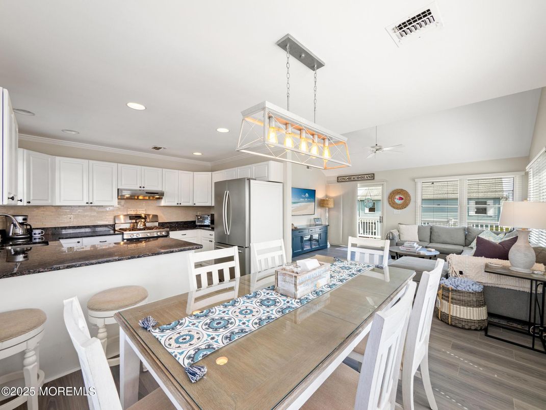 Dining room, Interior, Kitchen, Living room, Pendant Lights, Recessed Lighting, Stainless Steel Appliances, Wood Texture Flooring