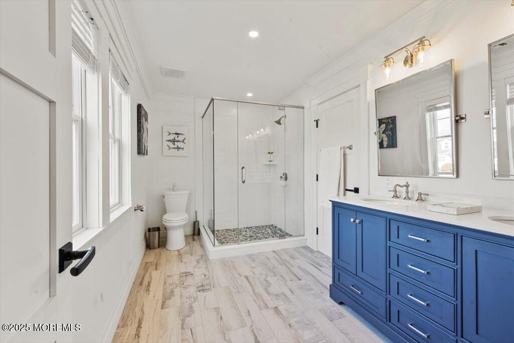 Bathroom, Dual Sink Vanities, Glass Shower, Interior, Recessed Lighting, Wood Texture Flooring