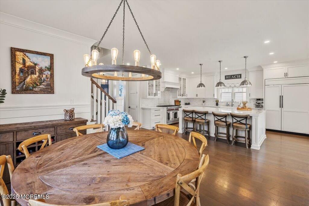 Chandelier, Dining room, Interior, Kitchen, Pendant Lights, Recessed Lighting, Stainless Steel Appliances, Wood Texture Flooring