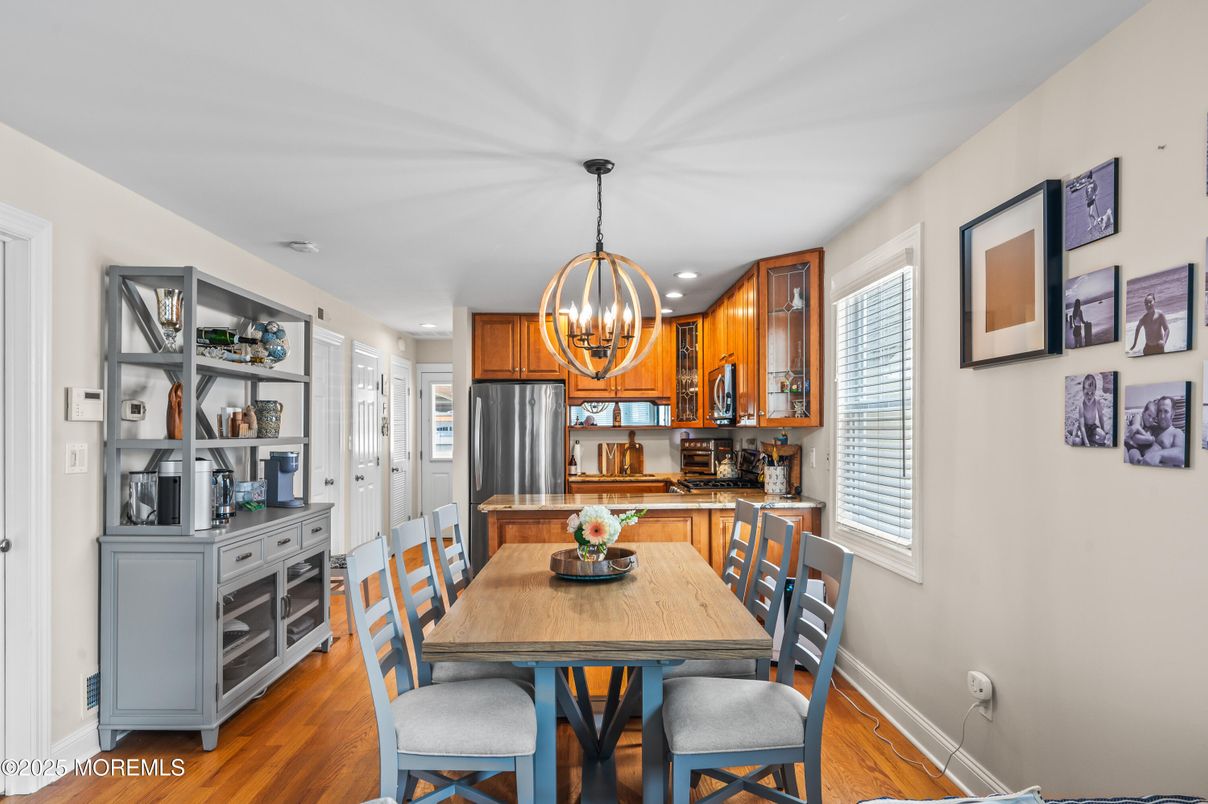 Chandelier, Dining room, Interior, Kitchen, Recessed Lighting, Stainless Steel Appliances, Wood Texture Flooring