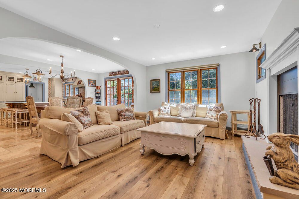 Chandelier, Dining room, Fireplace, Interior, Living room, Recessed Lighting, Wood Texture Flooring
