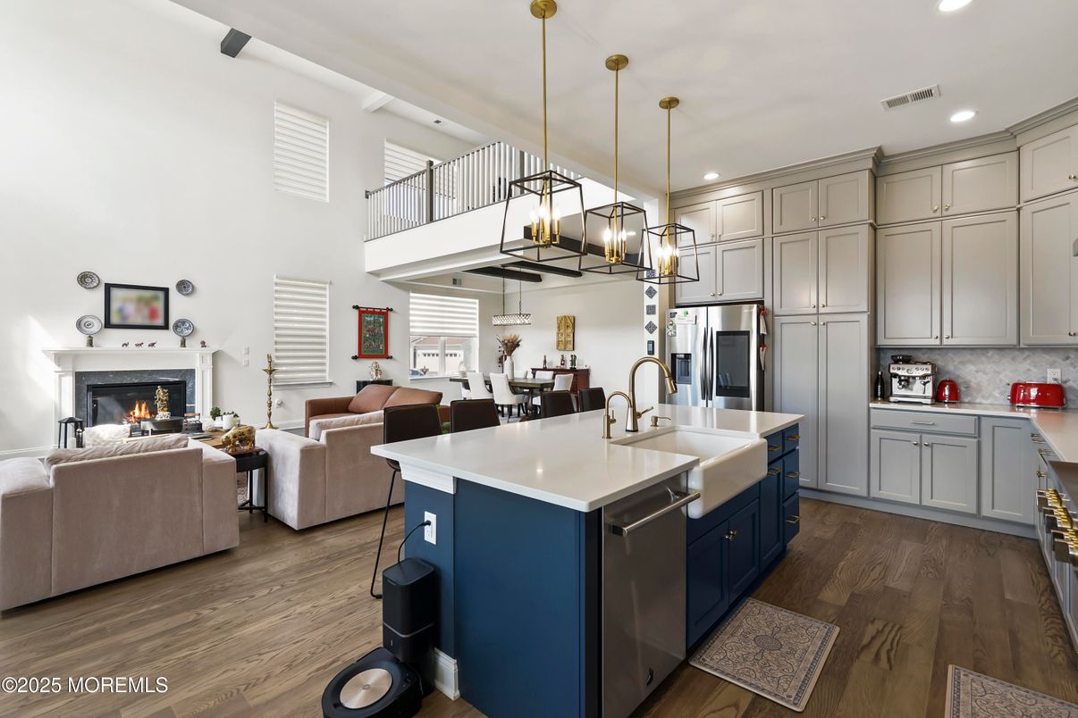Dining room, Fireplace, Interior, Kitchen, Living room, Pendant Lights, Recessed Lighting, Stainless Steel Appliances, Wood Texture Flooring