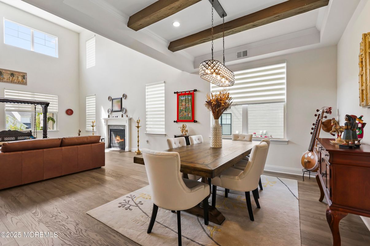 Chandelier, Dining room, Fireplace, Interior, Living room, Pendant Lights, Recessed Lighting, Wooden Beams, Wood Texture Flooring