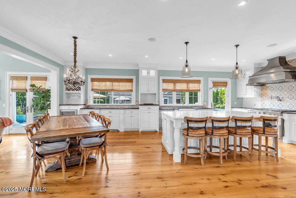 Chandelier, Dining room, Interior, Kitchen, Pendant Lights, Recessed Lighting, Stainless Steel Appliances, Wood Texture Flooring