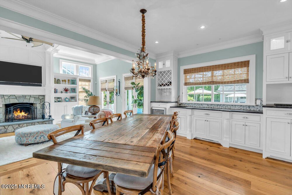 Chandelier, Dining room, Fireplace, Interior, Living room, Recessed Lighting, Wood Texture Flooring