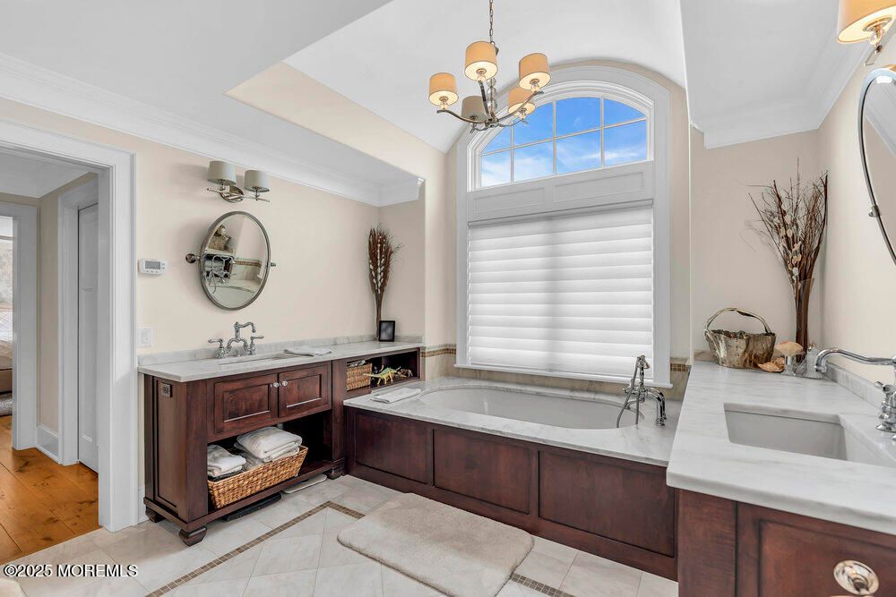 Bathroom, Chandelier, Dual Sink Vanities, Interior, Wood Texture Flooring
