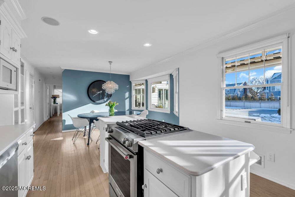 Chandelier, Dining room, Interior, Kitchen, Recessed Lighting, Stainless Steel Appliances, Water, Wood Texture Flooring