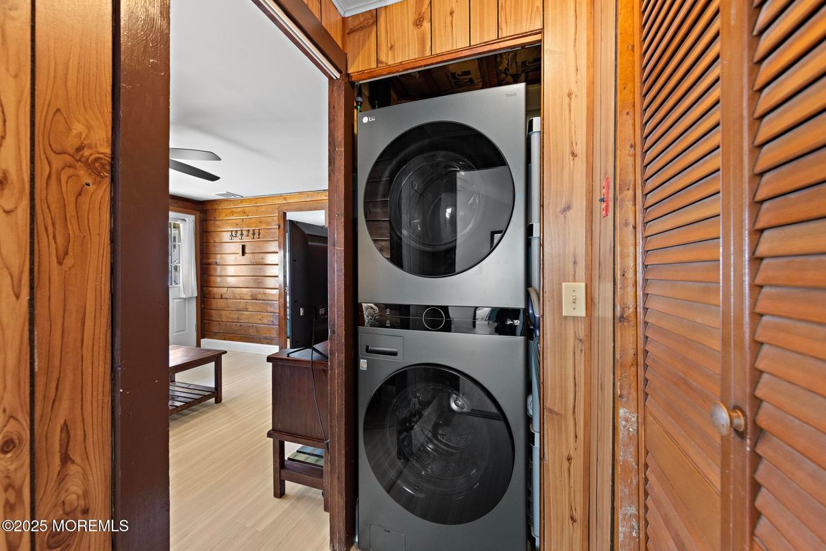 Interior, Utility Closets, Washer, Wood Texture Flooring, Wooden Walls
