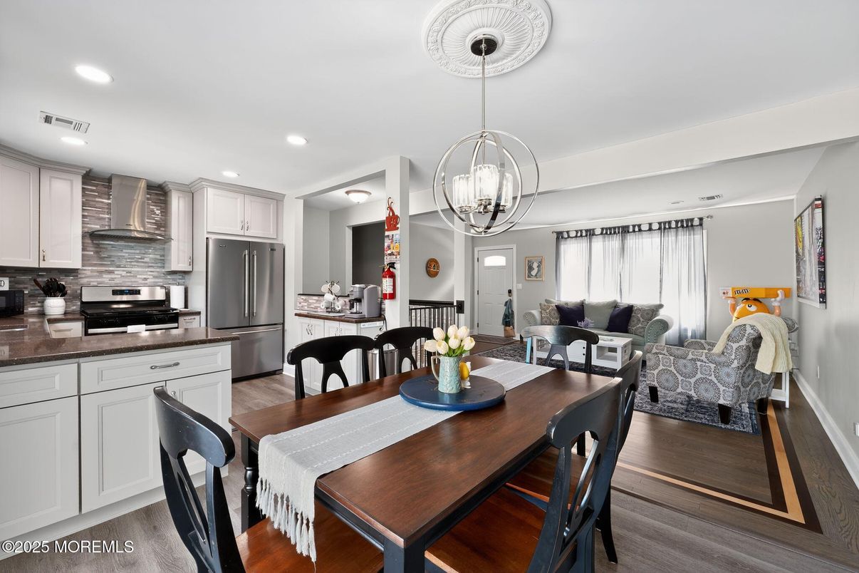 Dining room, Interior, Kitchen, Living room, Pendant Lights, Recessed Lighting, Stainless Steel Appliances, Wood Texture Flooring