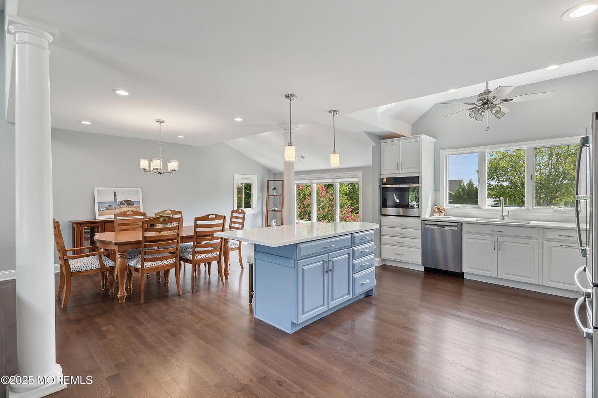 Chandelier, Dining room, Interior, Kitchen, Pendant Lights, Recessed Lighting, Stainless Steel Appliances, Wood Texture Flooring