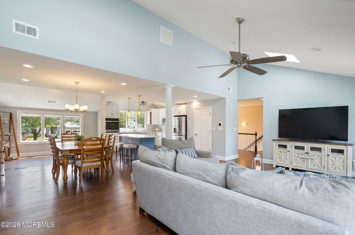 Chandelier, Dining room, Interior, Kitchen, Living room, Recessed Lighting, Stainless Steel Appliances, Wood Texture Flooring