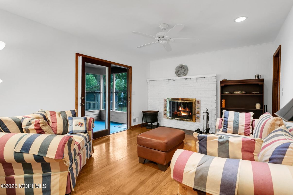 Fireplace, Interior, Living room, Recessed Lighting, Stone Walls, Wood Texture Flooring