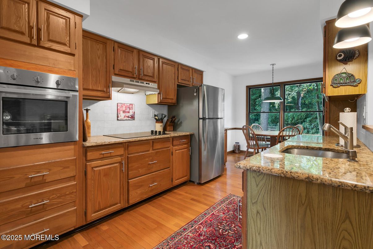 Dining room, Interior, Kitchen, Pendant Lights, Recessed Lighting, Stainless Steel Appliances, Wood Texture Flooring