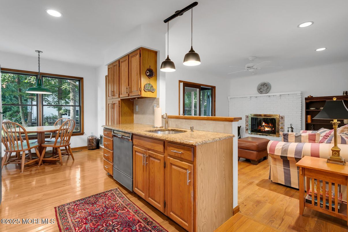 Dining room, Fireplace, Interior, Kitchen, Living room, Pendant Lights, Recessed Lighting, Wood Texture Flooring