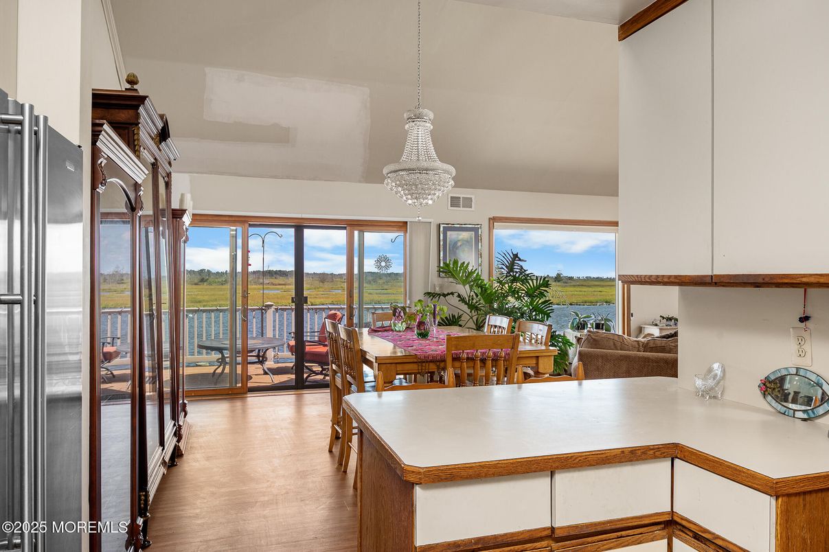 Chandelier, Dining room, Interior, Kitchen, Stainless Steel Appliances, Water, Wood Texture Flooring
