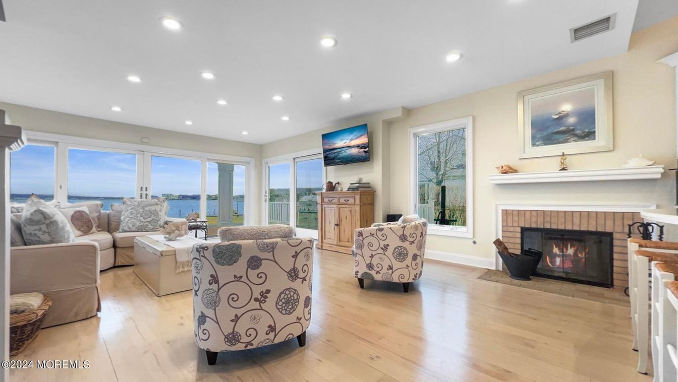 Fireplace, Interior, Living room, Recessed Lighting, Water, Wood Texture Flooring