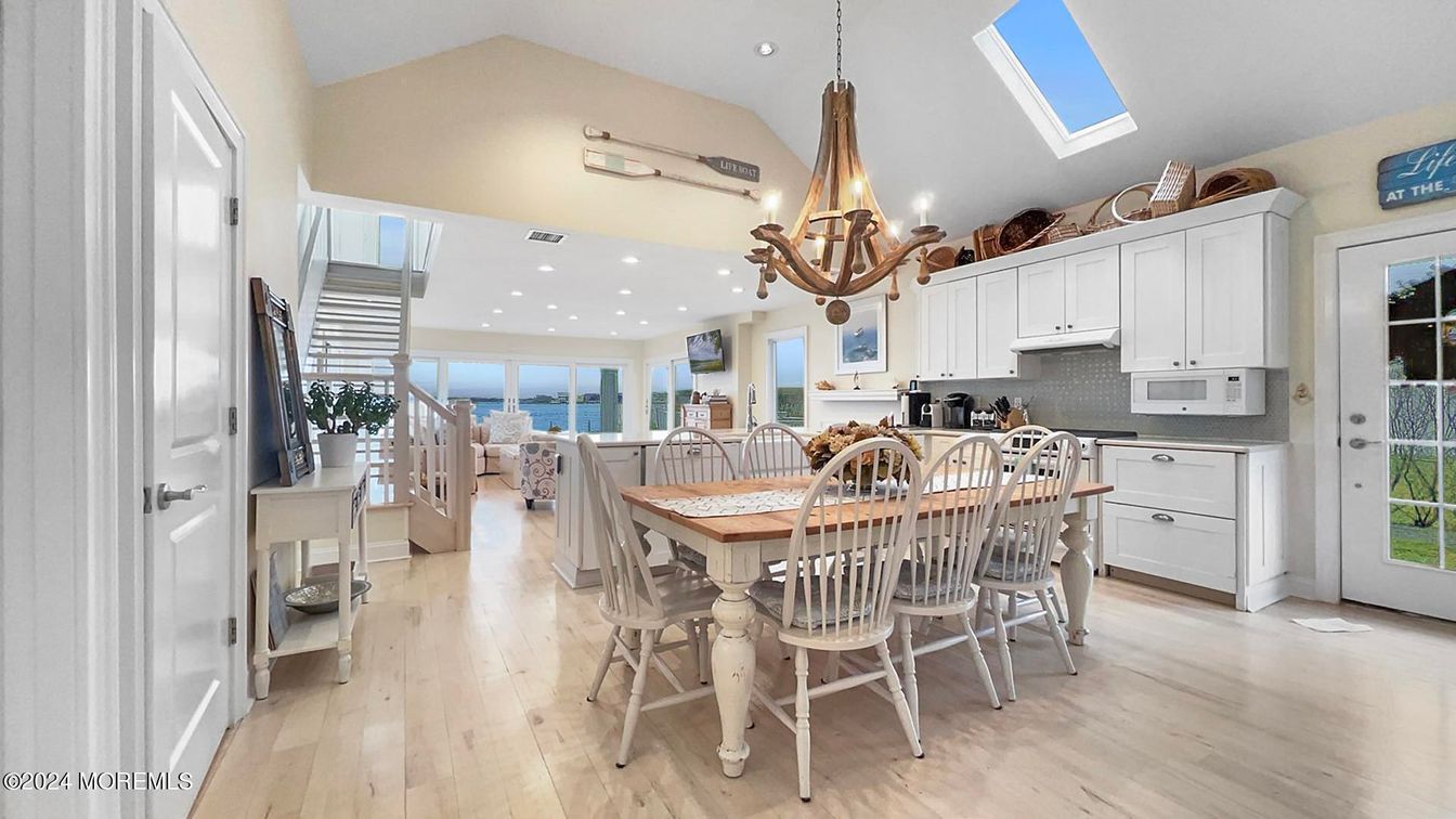 Chandelier, Dining room, Interior, Kitchen, Pendant Lights, Recessed Lighting, Water, Wood Texture Flooring