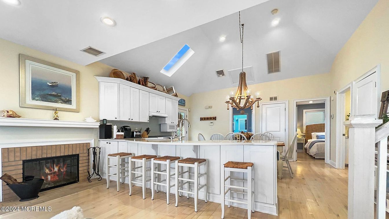 Chandelier, Fireplace, Interior, Kitchen, Recessed Lighting, Wood Texture Flooring