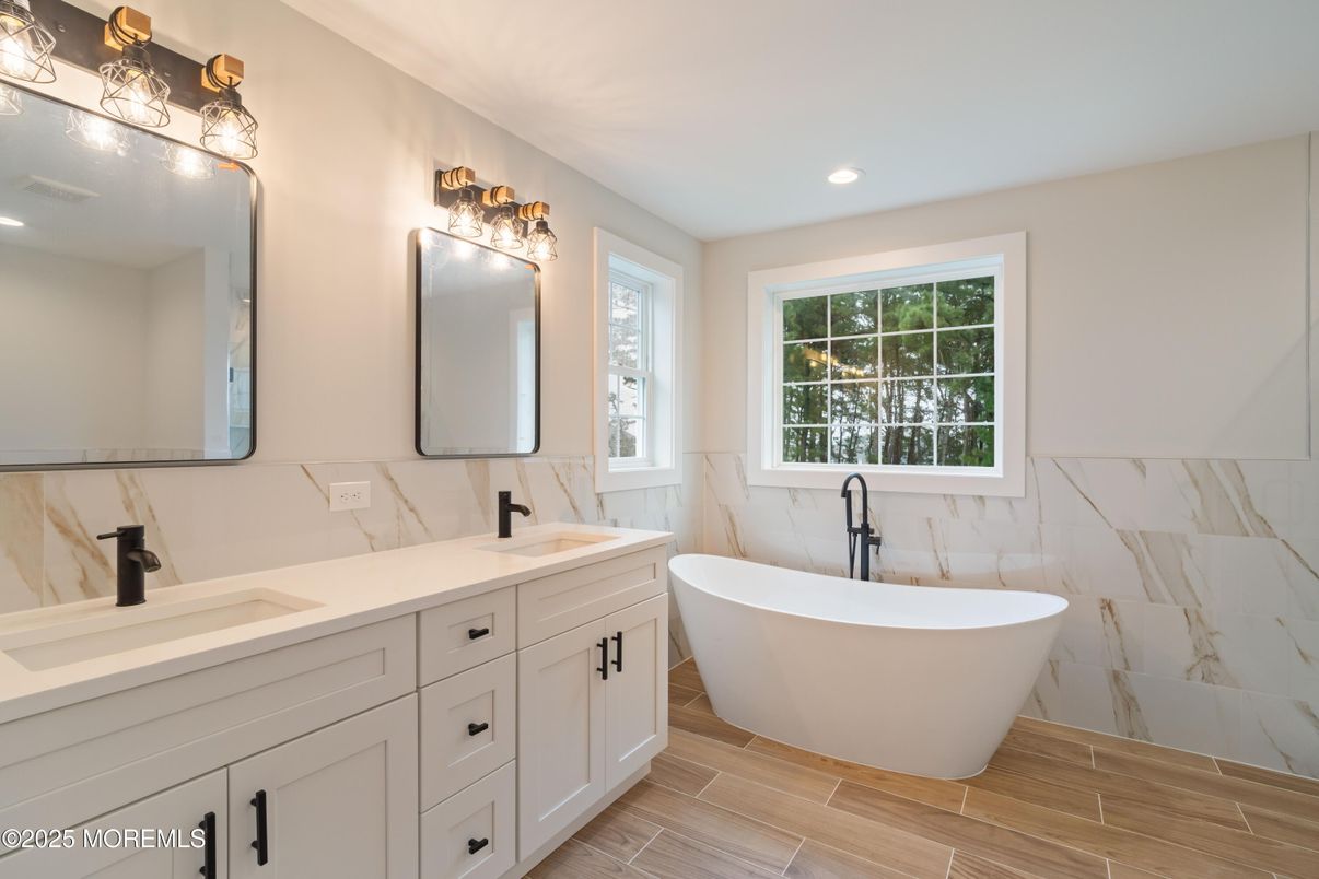 Bathroom, Dual Sink Vanities, Free Standing Baths, Interior, Marble Walls, Recessed Lighting, Wood Texture Flooring