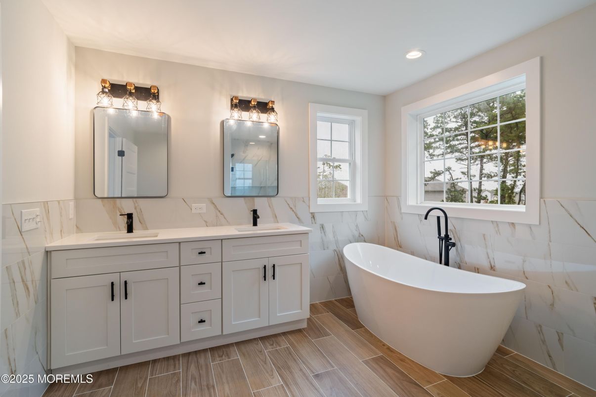 Bathroom, Dual Sink Vanities, Free Standing Baths, Interior, Marble Walls, Recessed Lighting, Wood Texture Flooring