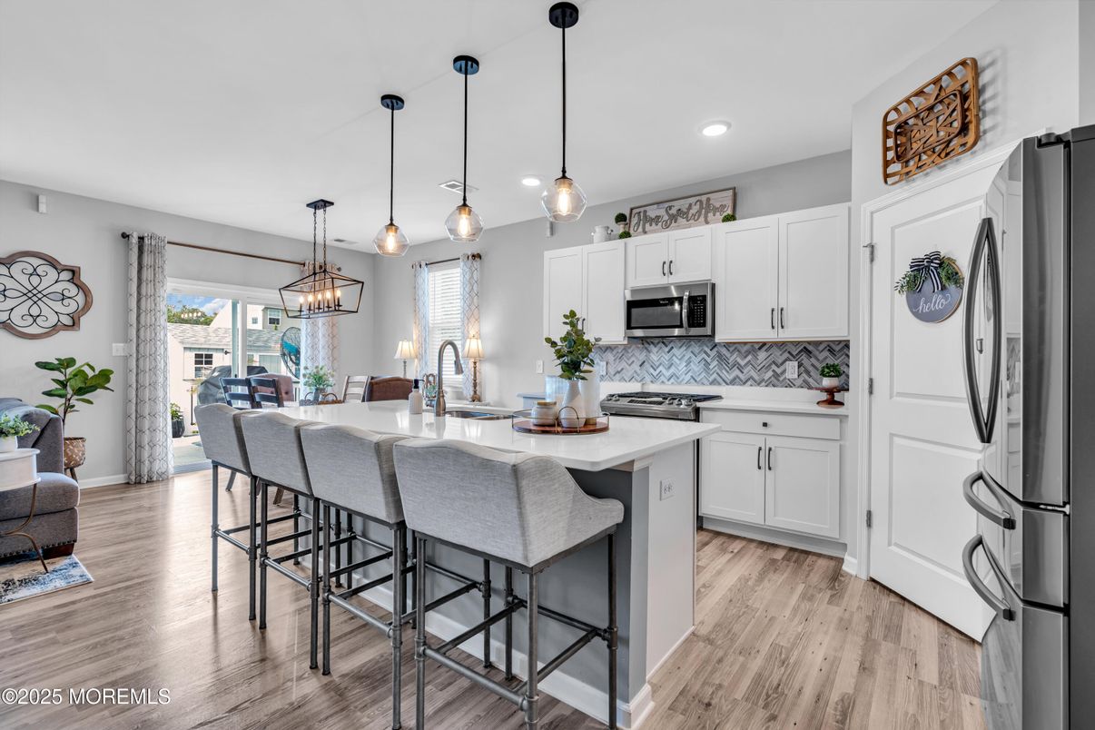 Dining room, Interior, Kitchen, Pendant Lights, Recessed Lighting, Stainless Steel Appliances, Wood Texture Flooring