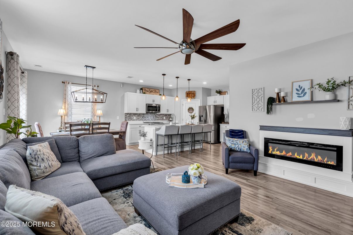 Dining room, Fireplace, Interior, Kitchen, Living room, Pendant Lights, Recessed Lighting, Stainless Steel Appliances, Wood Texture Flooring