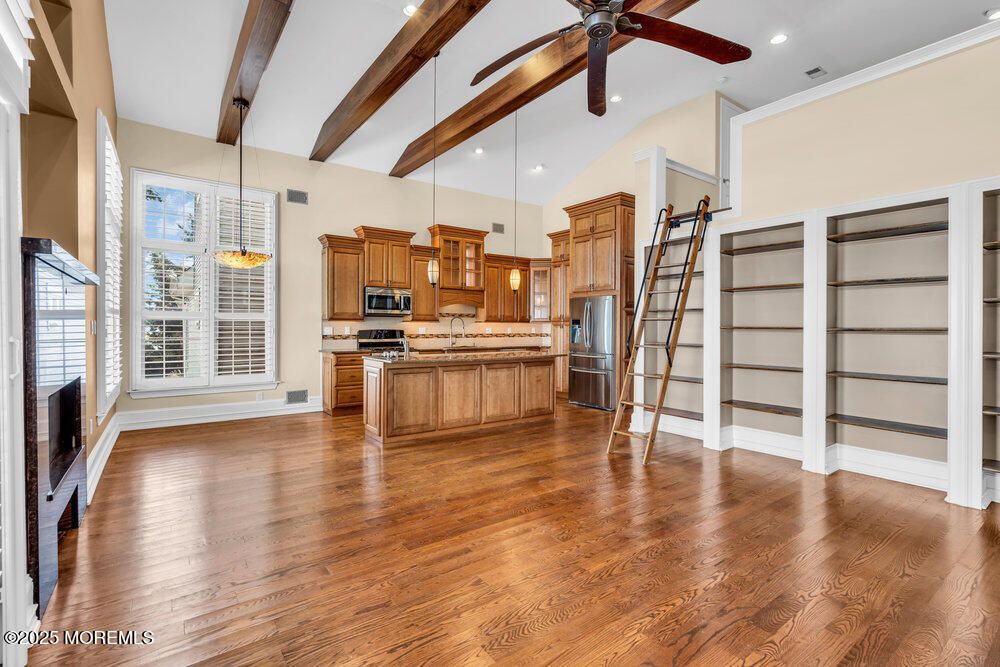 Empty room, Interior, Kitchen, Pendant Lights, Recessed Lighting, Stainless Steel Appliances, Wooden Beams, Wood Texture Flooring