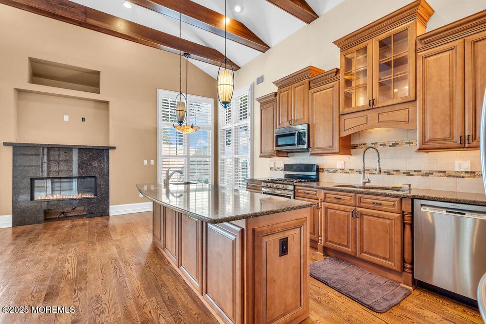 Fireplace, Interior, Kitchen, Pendant Lights, Recessed Lighting, Stainless Steel Appliances, Wooden Beams, Wood Texture Flooring