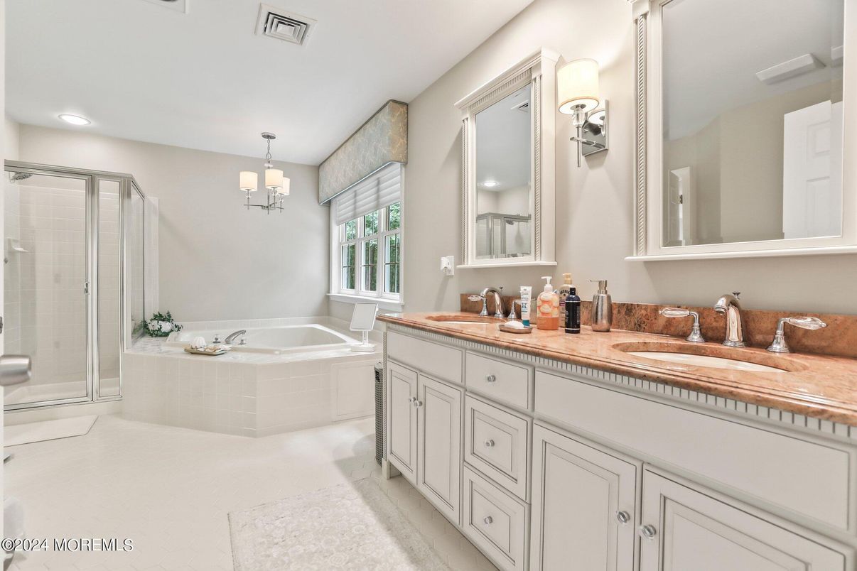 Bathroom, Chandelier, Dual Sink Vanities, Glass Shower, Interior, Pendant Lights, Recessed Lighting, Tile Countertops