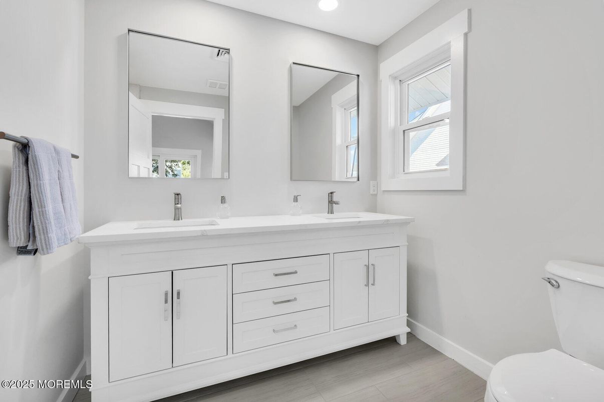 Bathroom, Dual Sink Vanities, Interior, Recessed Lighting, Wood Texture Flooring