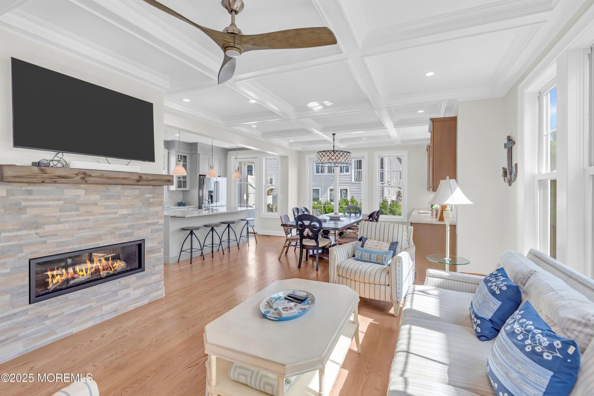 Dining room, Fireplace, Interior, Kitchen, Living room, Pendant Lights, Recessed Lighting, Stainless Steel Appliances, Stone Walls, Wood Texture Flooring