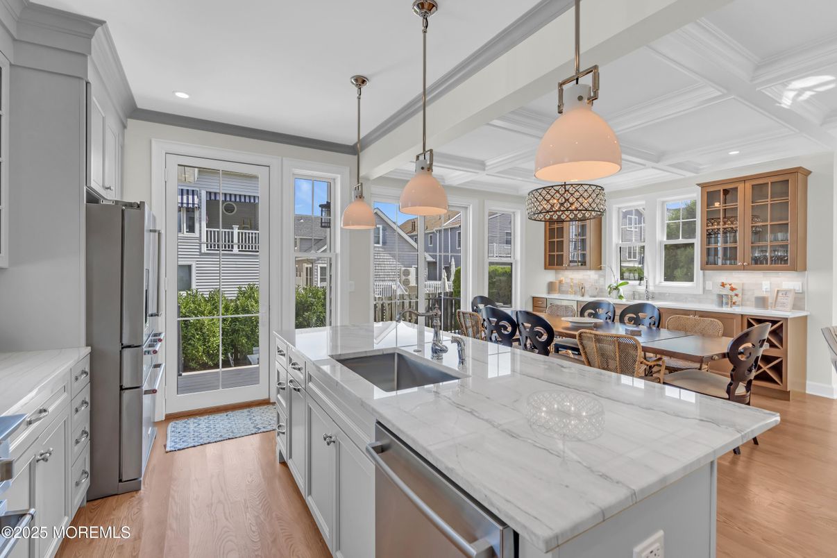 Dining room, Interior, Kitchen, Pendant Lights, Recessed Lighting, Stainless Steel Appliances, Wood Texture Flooring