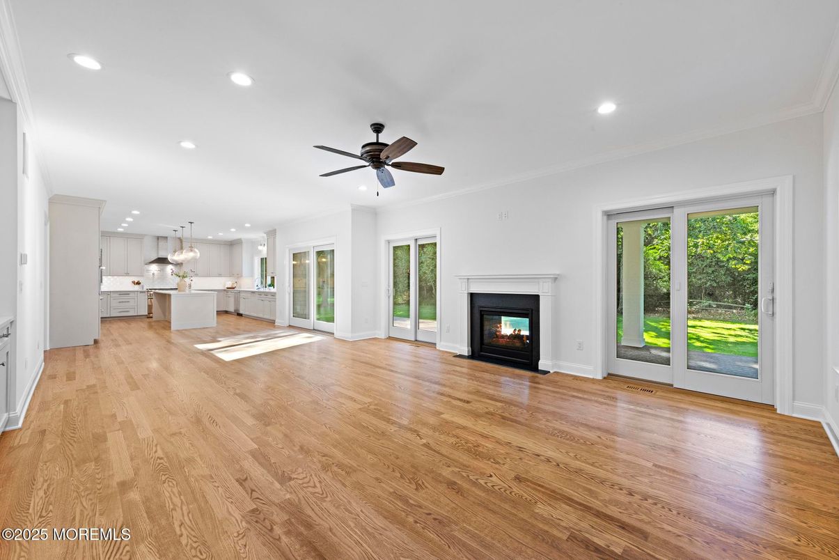 Empty room, Fireplace, Interior, Kitchen, Pendant Lights, Recessed Lighting, Wood Texture Flooring
