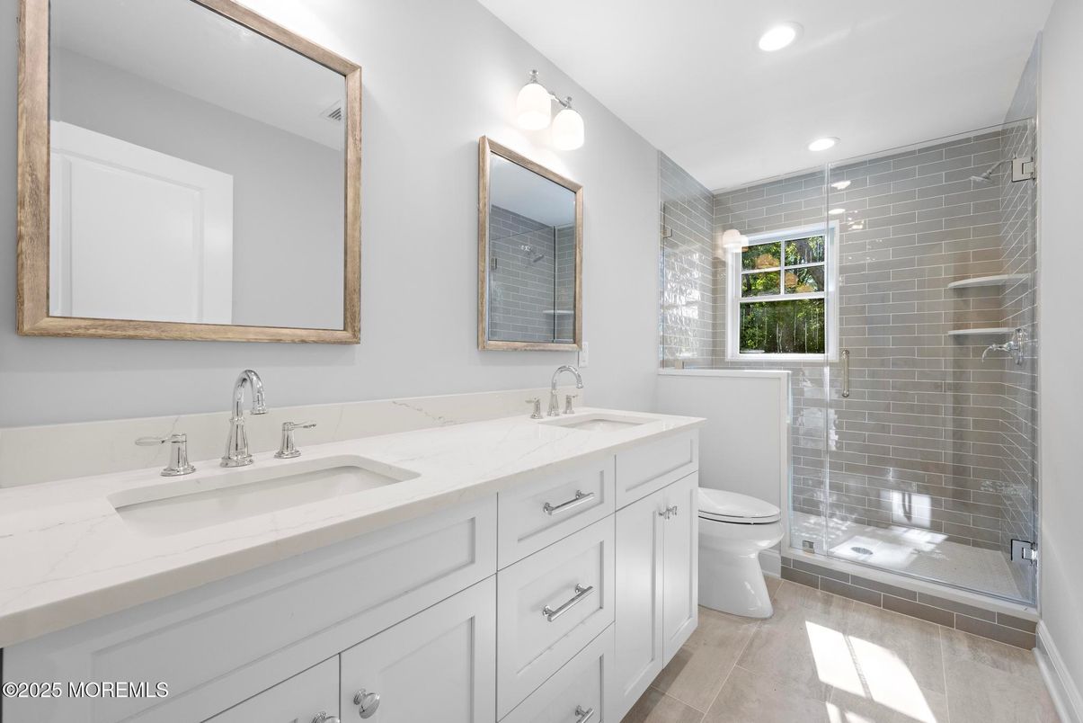 Bathroom, Dual Sink Vanities, Glass Shower, Interior, Recessed Lighting, Wood Texture Flooring