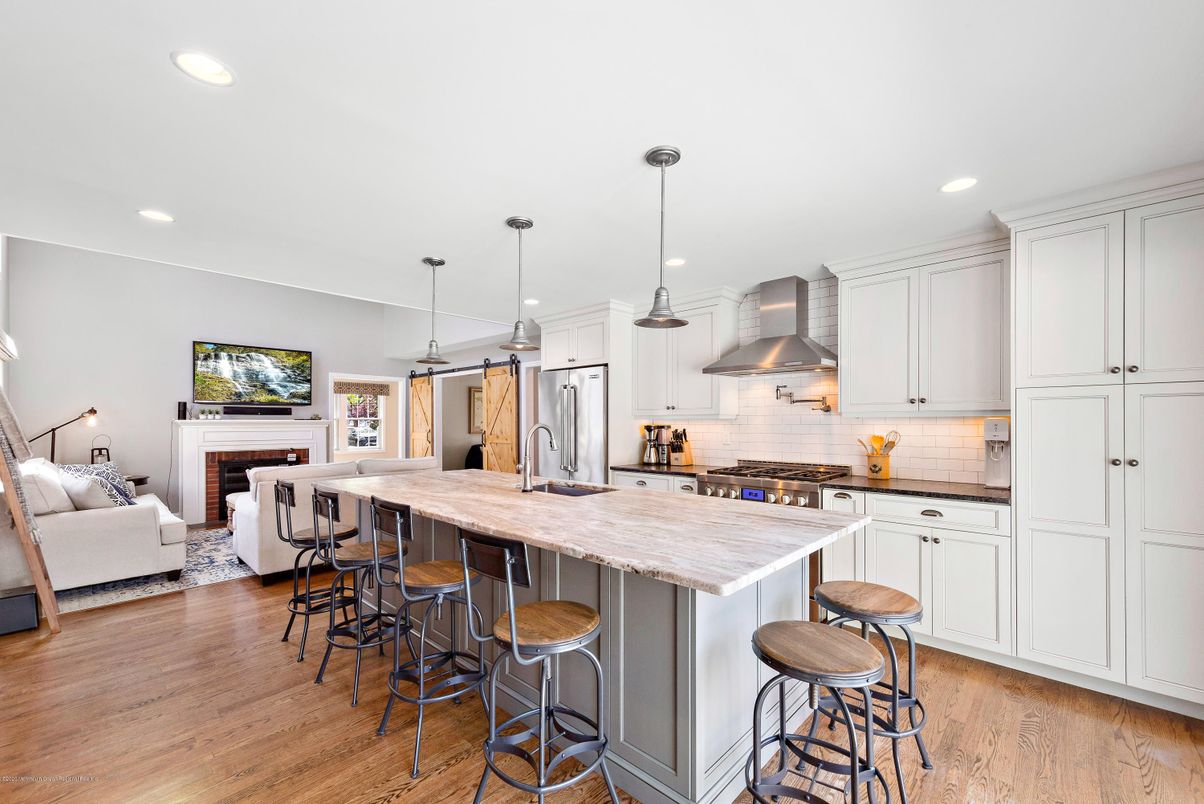 Fireplace, Interior, Kitchen, Living room, Pendant Lights, Recessed Lighting, Stainless Steel Appliances, Wood Texture Flooring