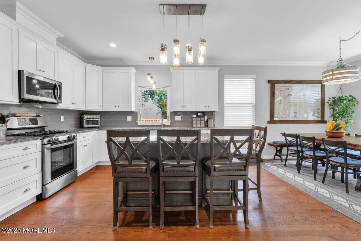 Dining room, Interior, Kitchen, Pendant Lights, Recessed Lighting, Stainless Steel Appliances, Wood Texture Flooring