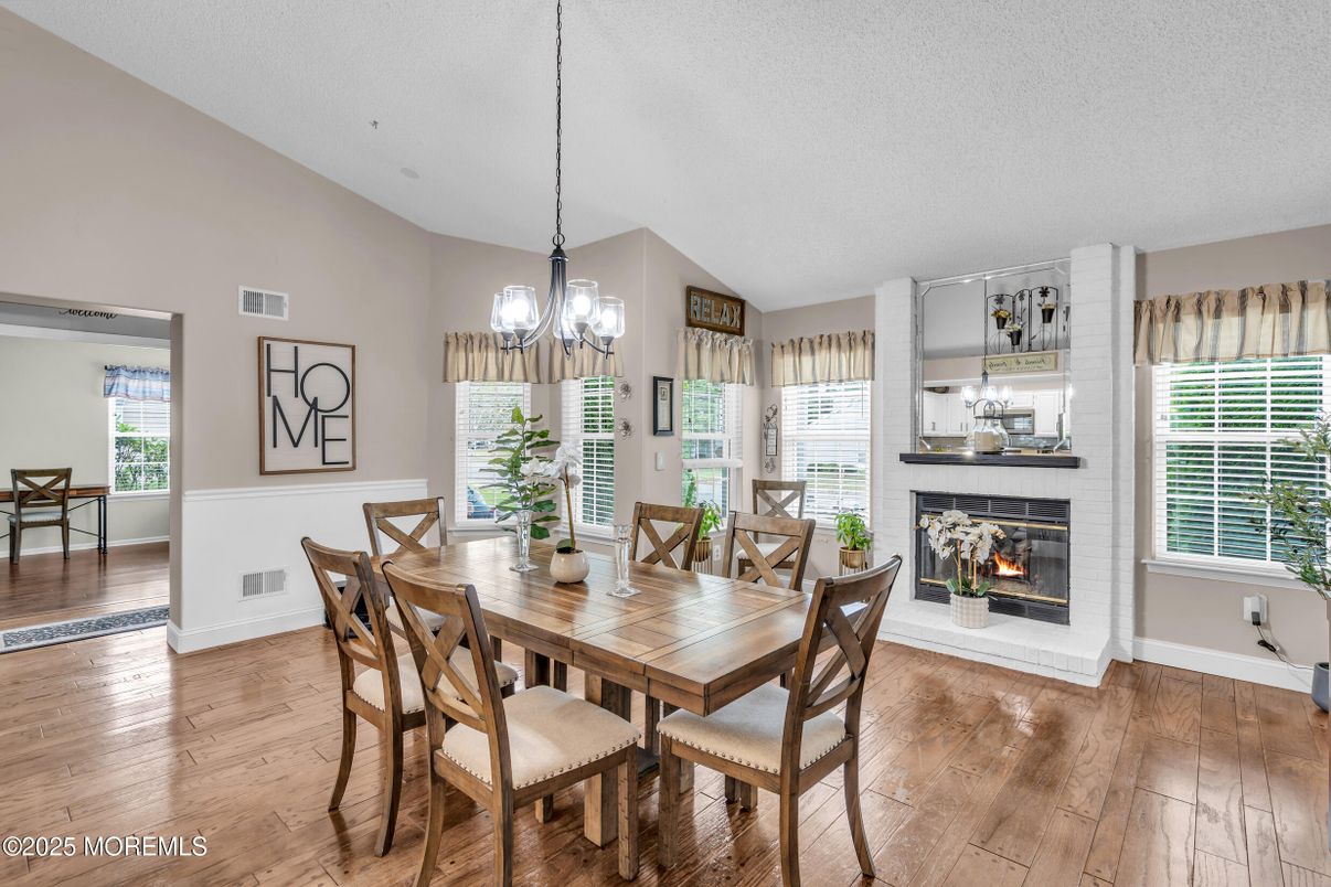 Chandelier, Dining room, Fireplace, Interior, Pendant Lights, Wood Texture Flooring