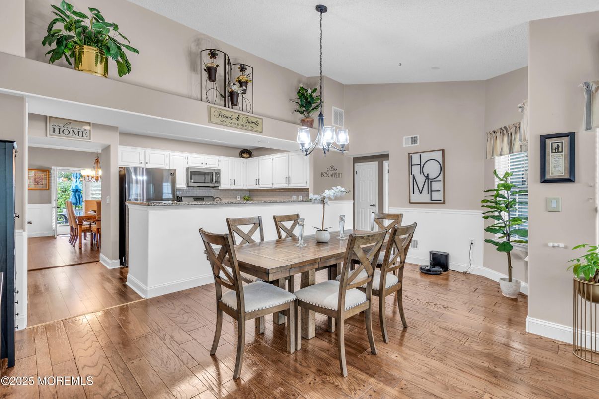 Chandelier, Dining room, Interior, Kitchen, Pendant Lights, Stainless Steel Appliances, Wood Texture Flooring