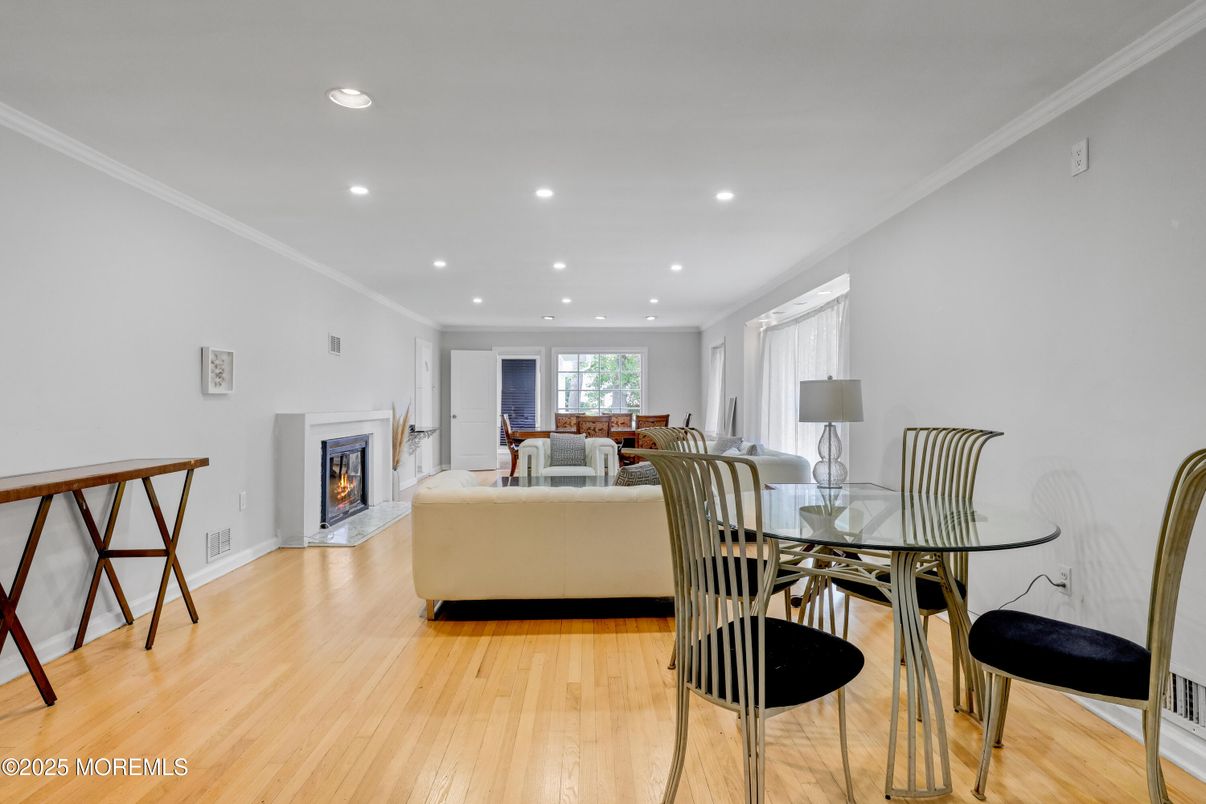 Dining room, Fireplace, Interior, Living room, Recessed Lighting, Wood Texture Flooring