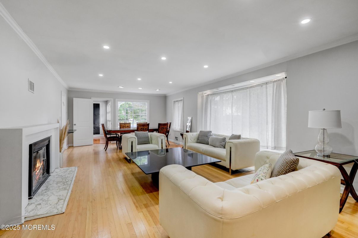 Dining room, Fireplace, Interior, Living room, Recessed Lighting, Wood Texture Flooring