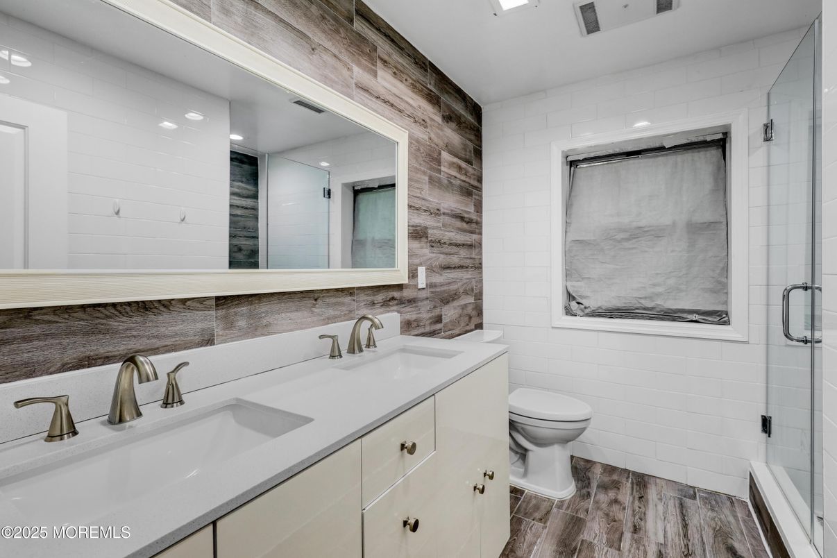 Bathroom, Dual Sink Vanities, Glass Shower, Interior, Recessed Lighting, Wood Texture Flooring