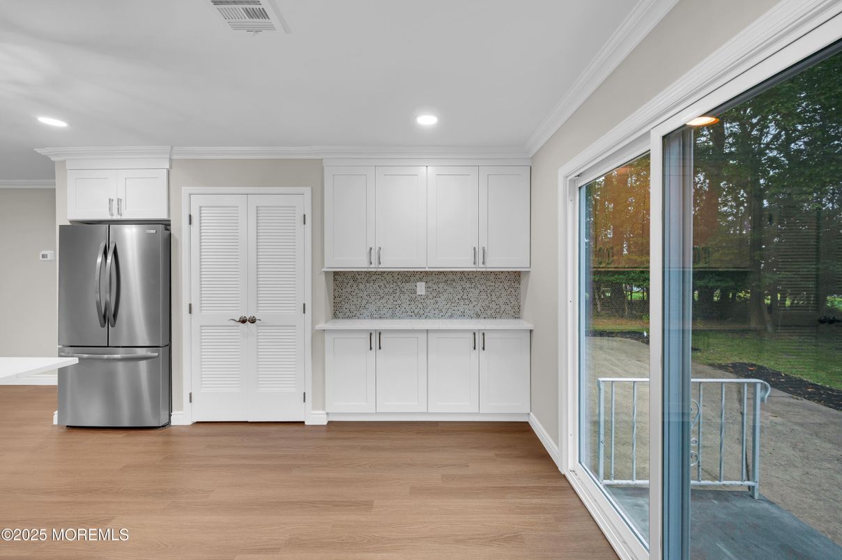Interior, Kitchen, Recessed Lighting, Washer, Wood Texture Flooring