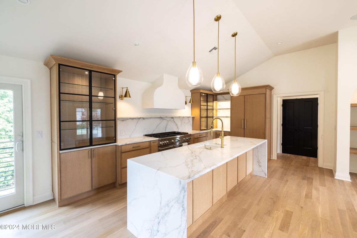 Interior, Kitchen, Marble Walls, Pendant Lights, Recessed Lighting, Wood Texture Flooring
