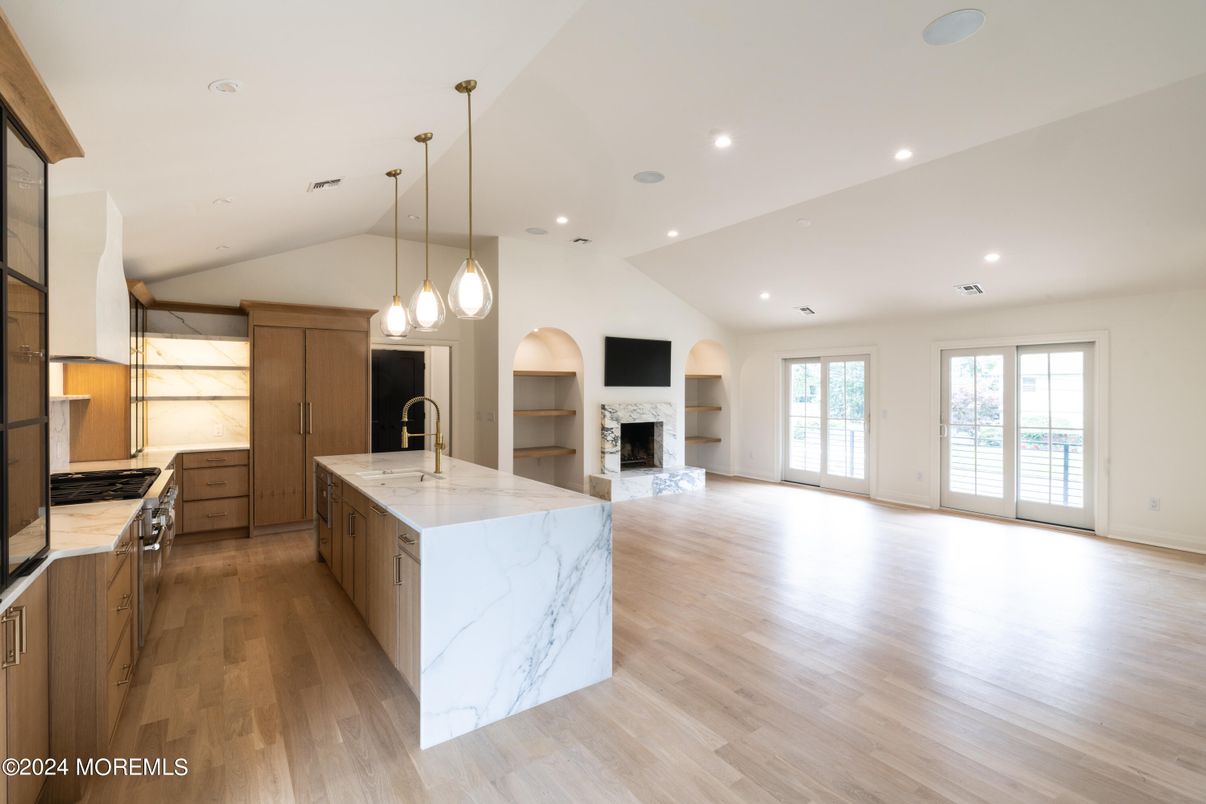 Empty room, Fireplace, Interior, Kitchen, Pendant Lights, Recessed Lighting, Wood Texture Flooring