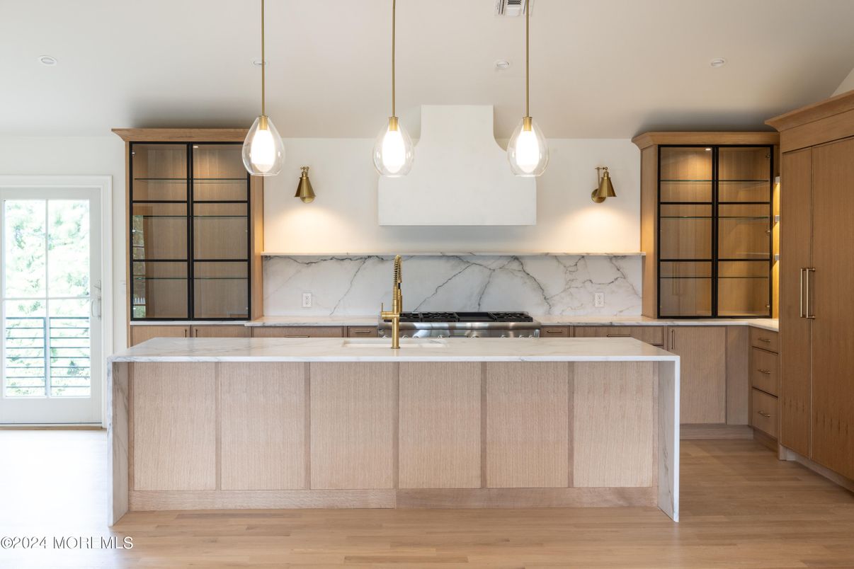 Interior, Kitchen, Marble Walls, Pendant Lights, Recessed Lighting, Stainless Steel Appliances, Wood Texture Flooring